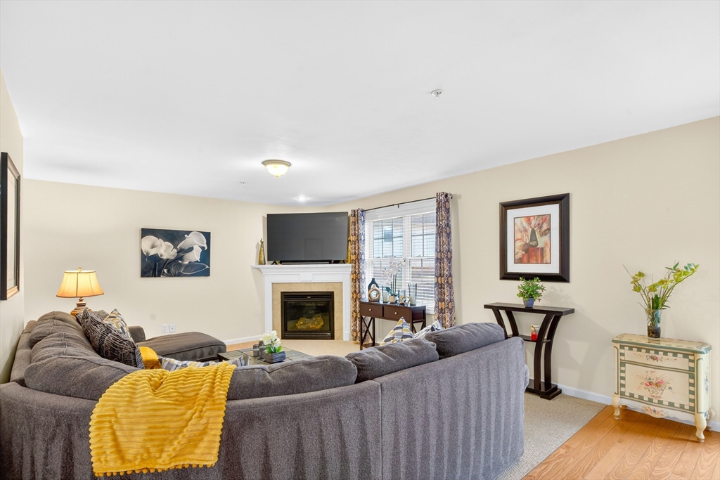 615 Nashua Road, Unit 9 Dracut, MA 01826 - Photo 17 of 38 a living room with furniture and a fireplace