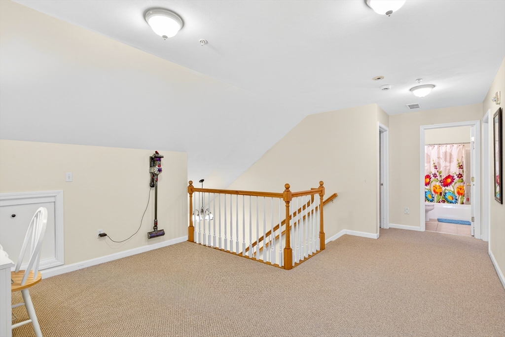 615 Nashua Road, Unit 9 Dracut, MA 01826 - Photo 21 of 38 a view of a garage with furniture