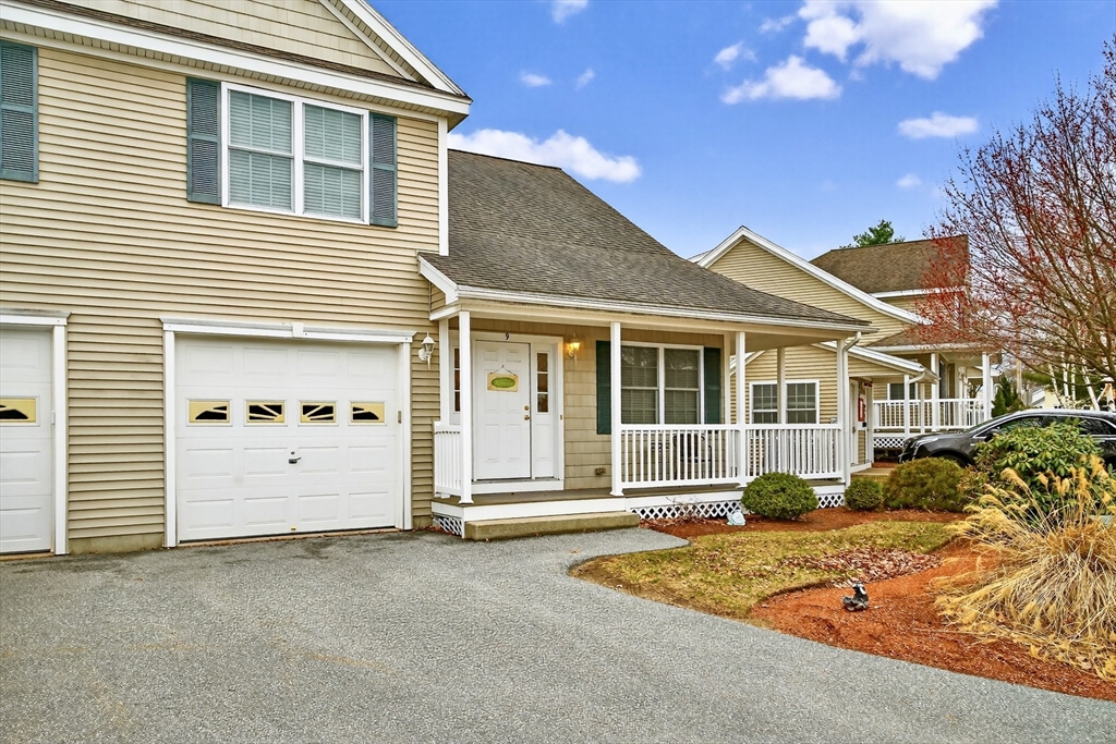 615 Nashua Road, Unit 9 Dracut, MA 01826 - Photo 3 of 38 a front view of a house with a yard