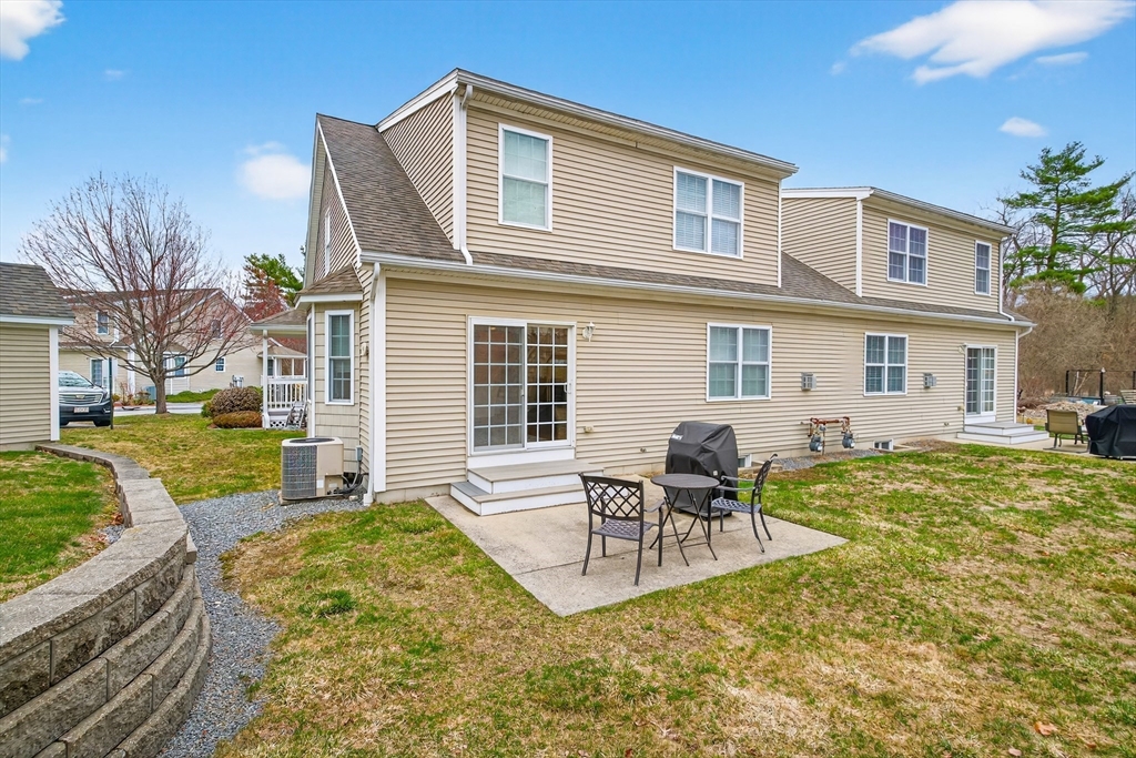615 Nashua Road, Unit 9 Dracut, MA 01826 - Photo 34 of 38 a view of a house with a patio