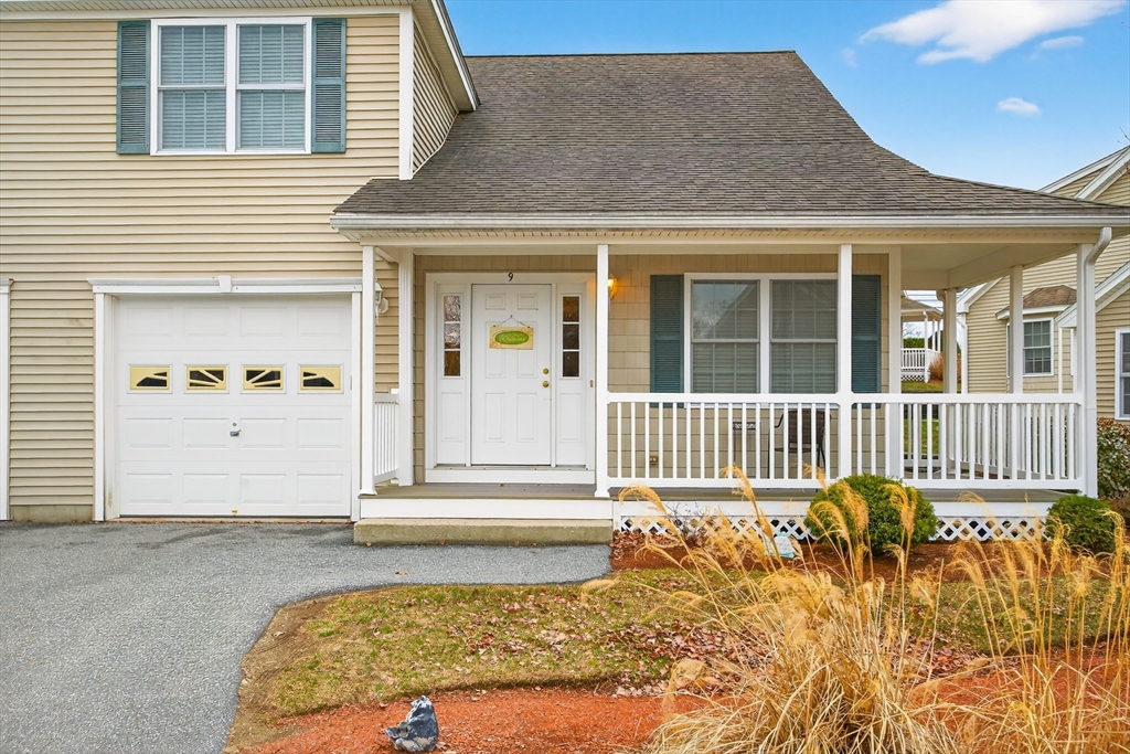 615 Nashua Road, Unit 9 Dracut, MA 01826 - Photo 4 of 38 front view of a house with a porch