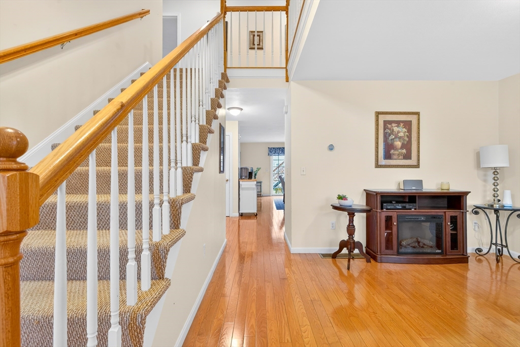 615 Nashua Road, Unit 9 Dracut, MA 01826 - Photo 7 of 38 a view of a living room with furniture and wooden floor