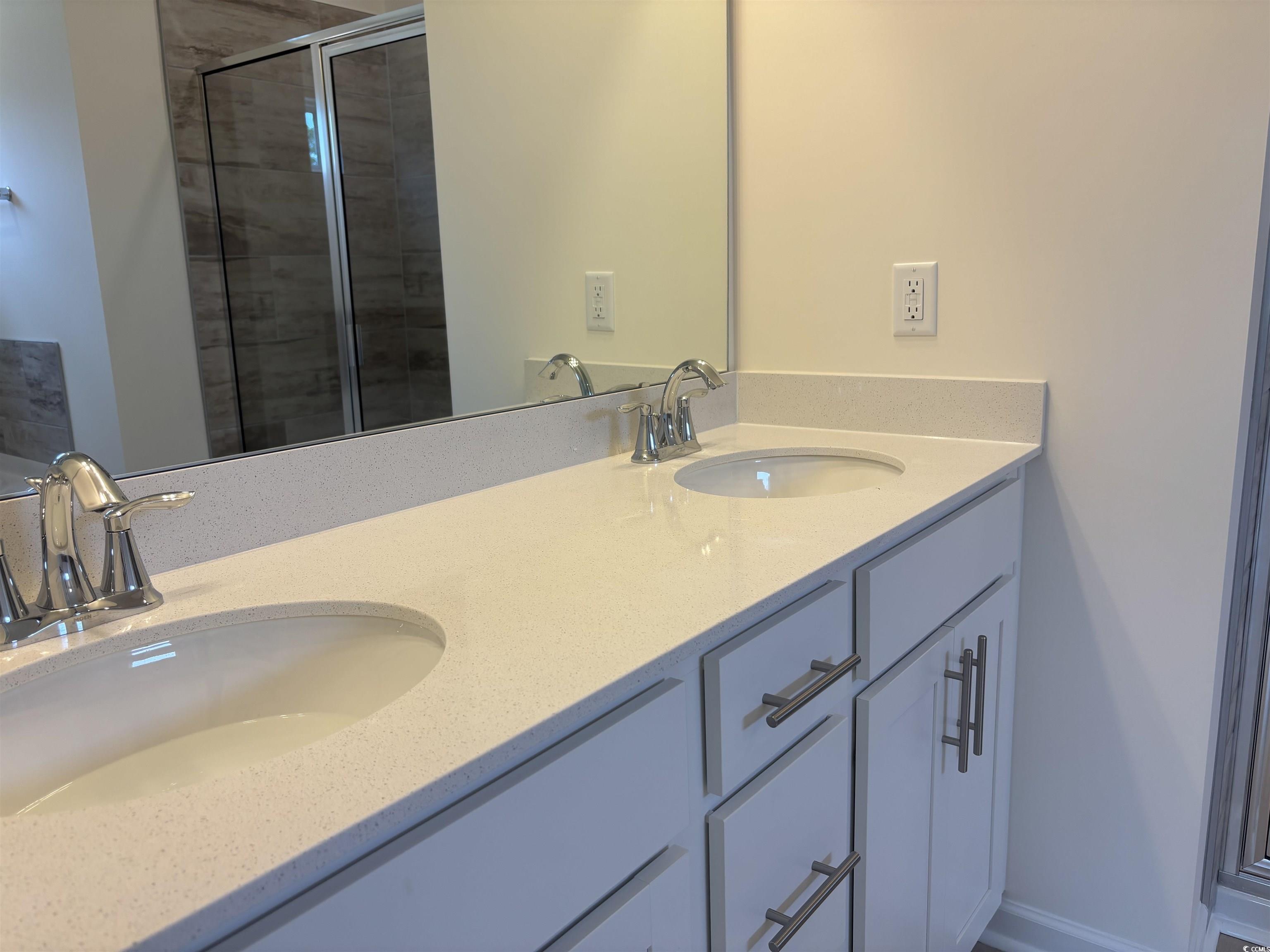 7059 Shady Grove Road Conway, SC 29527 - Photo 18 of 37 Full bath with double vanity, a sink, and a stall