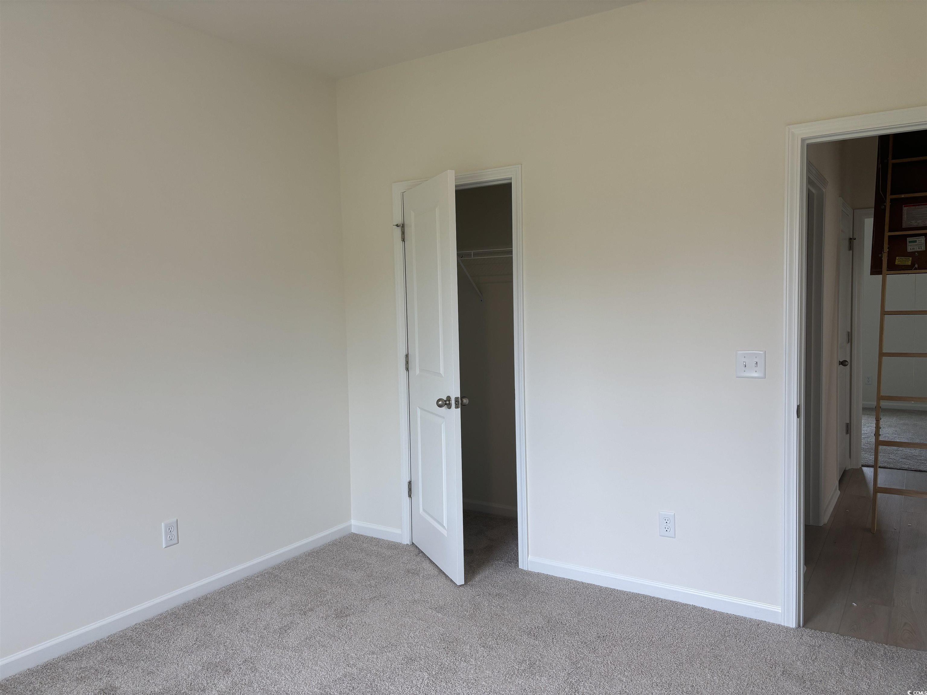 7059 Shady Grove Road Conway, SC 29527 - Photo 19 of 37 Unfurnished bedroom featuring a closet, baseboards
