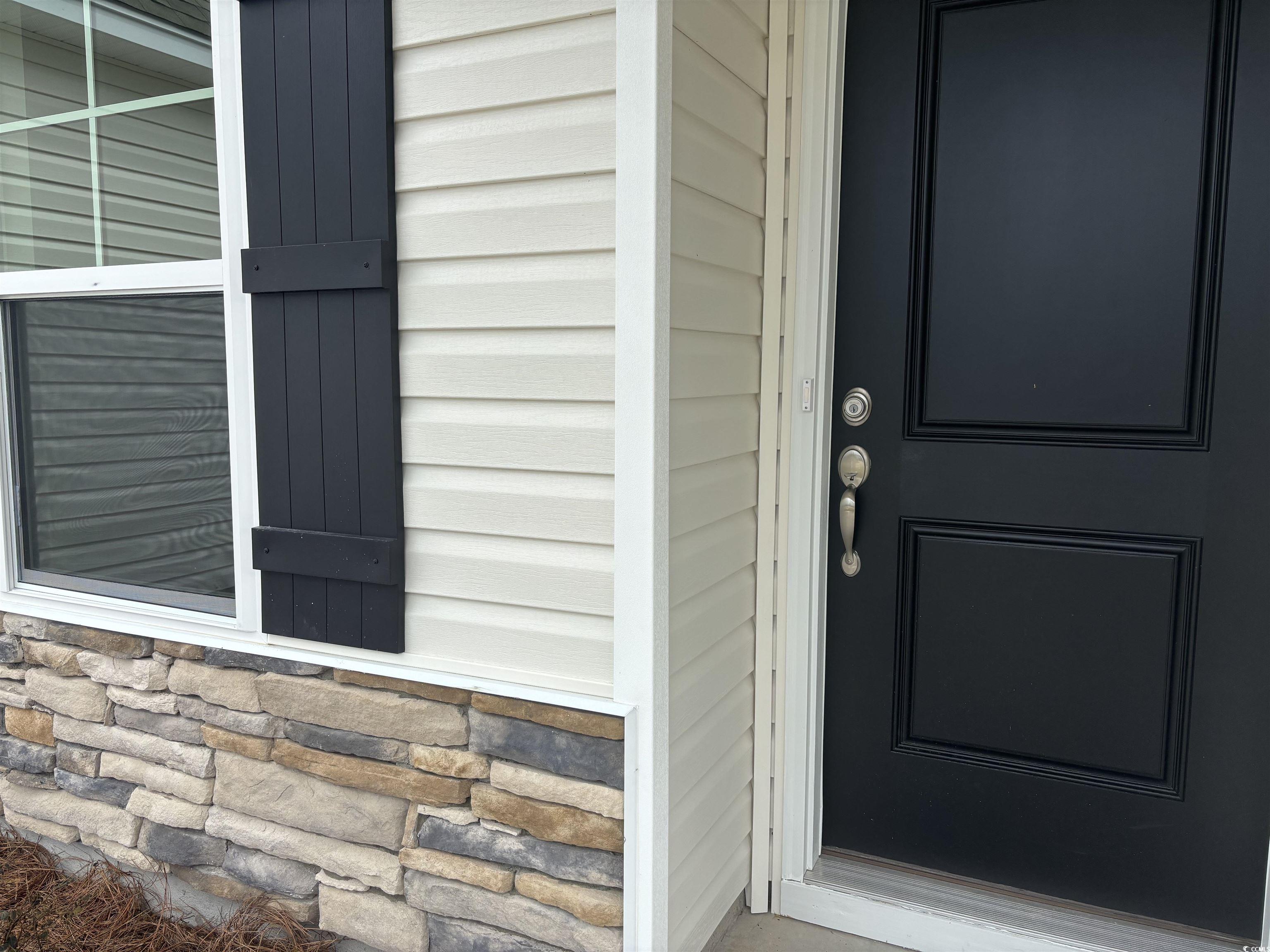 7059 Shady Grove Road Conway, SC 29527 - Photo 4 of 37 Doorway to property featuring stone siding