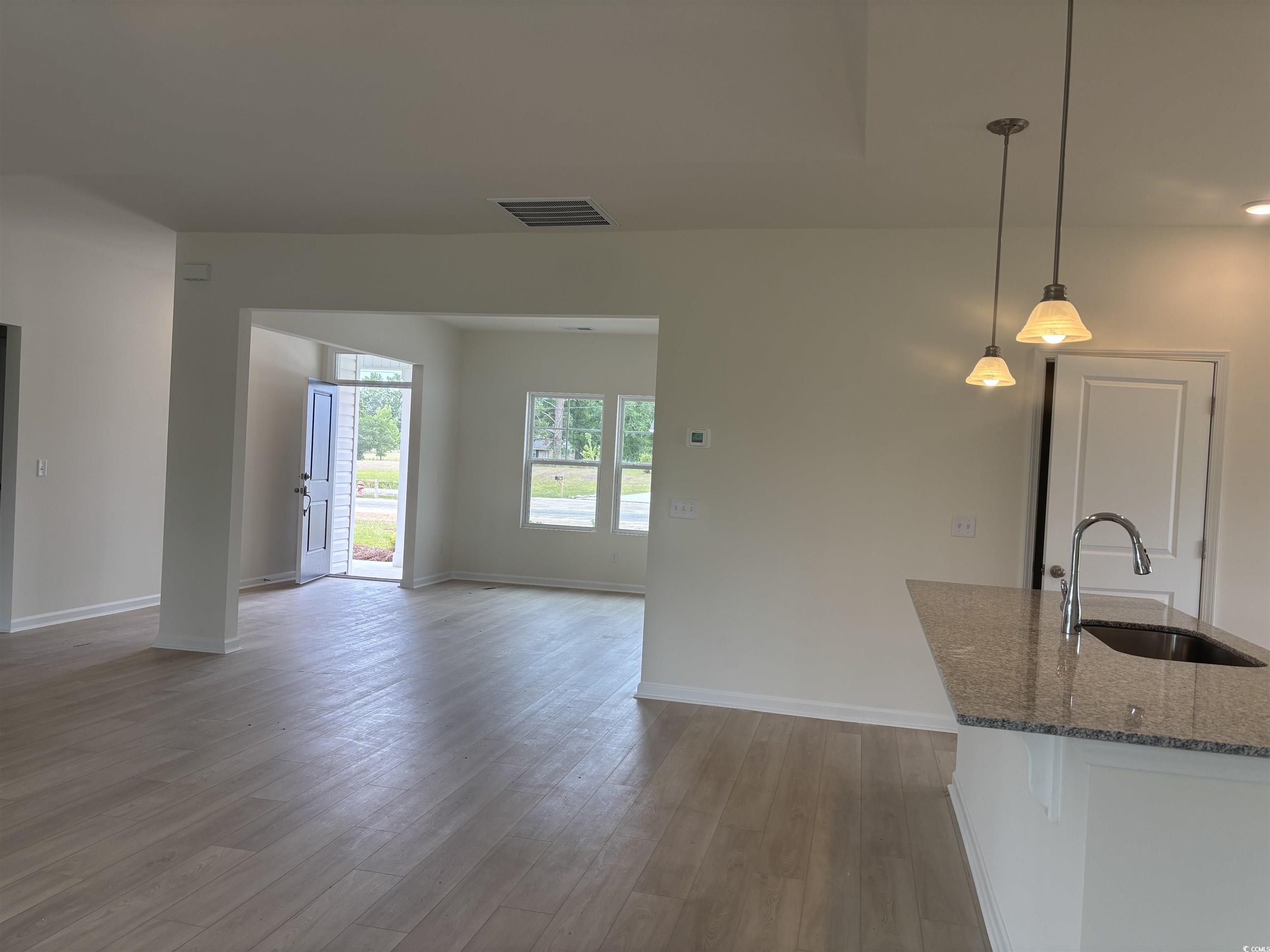 7059 Shady Grove Road Conway, SC 29527 - Photo 9 of 37 Unfurnished living room with visible vents, a sink