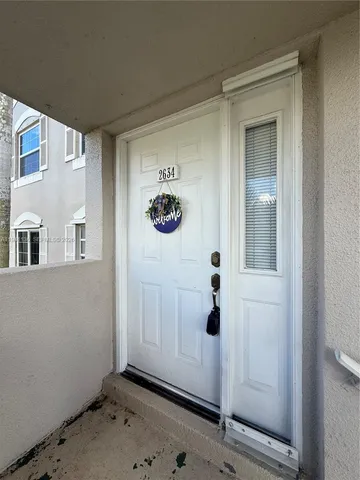 a view of a hallway with closet