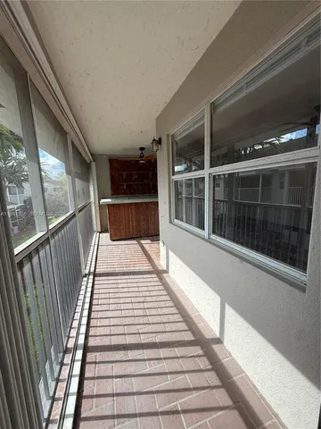 a view of balcony with a glass door