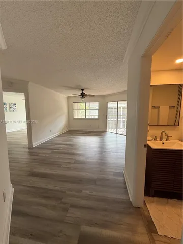 a view of a living room and hardwood floor