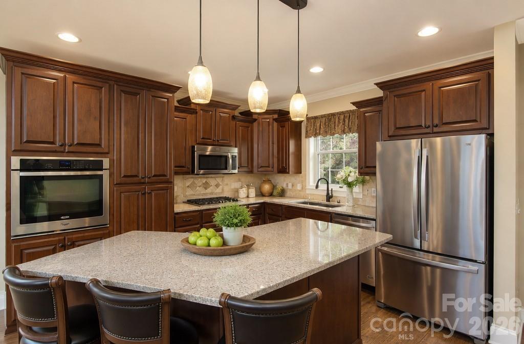 12 Chigger Ridge Road Sylva, NC 28779 - Photo 4 of 30 a kitchen with stainless steel appliances granite countertop a sink refrigerator and microwave