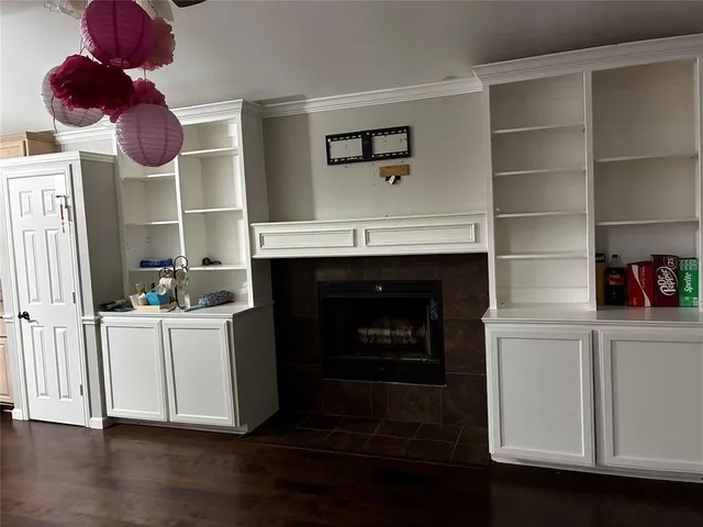 a kitchen with a cabinets and fireplace