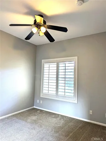 a bathroom with a sink mirror and toilet