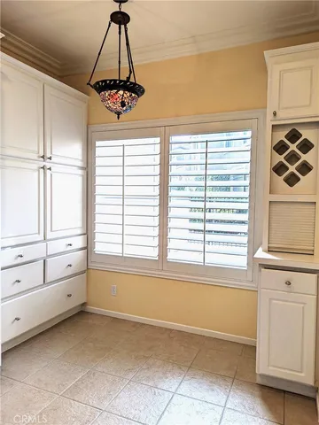 a view of a room with window and cabinet