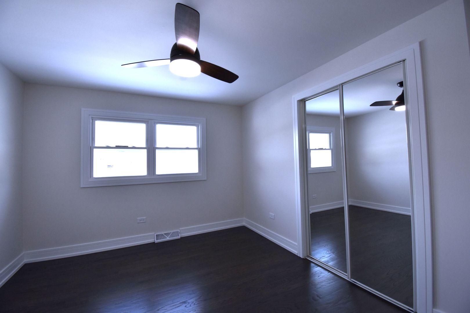 16400 Roy Street Oak Forest, IL 60452 - Photo 14 of 22 an empty room with wooden floor closet and windows