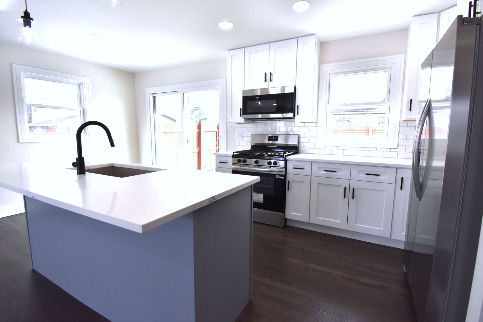 16400 Roy Street Oak Forest, IL 60452 - Photo 4 of 22 a kitchen with stainless steel appliances a sink stove and cabinets