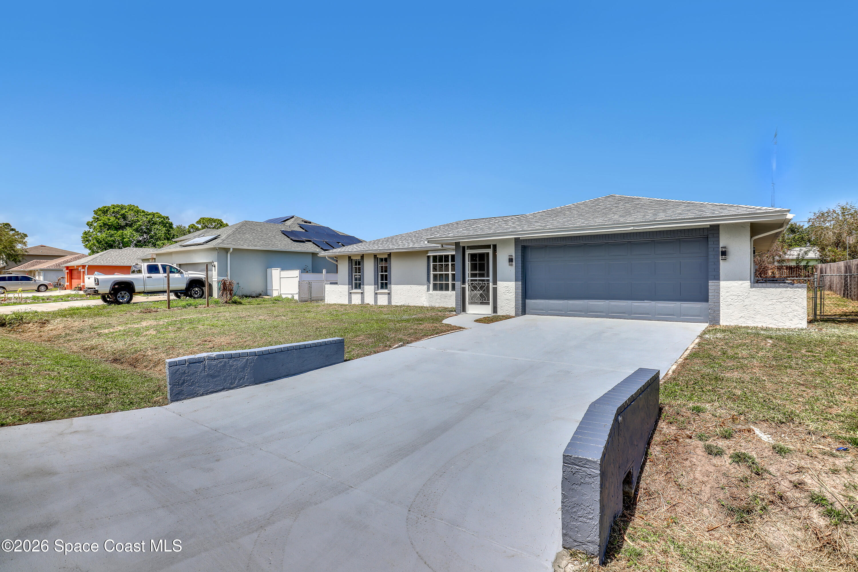 999 Castile Road Southeast Palm Bay, FL 32909 - Photo 4 of 45 Same Front Driveway side