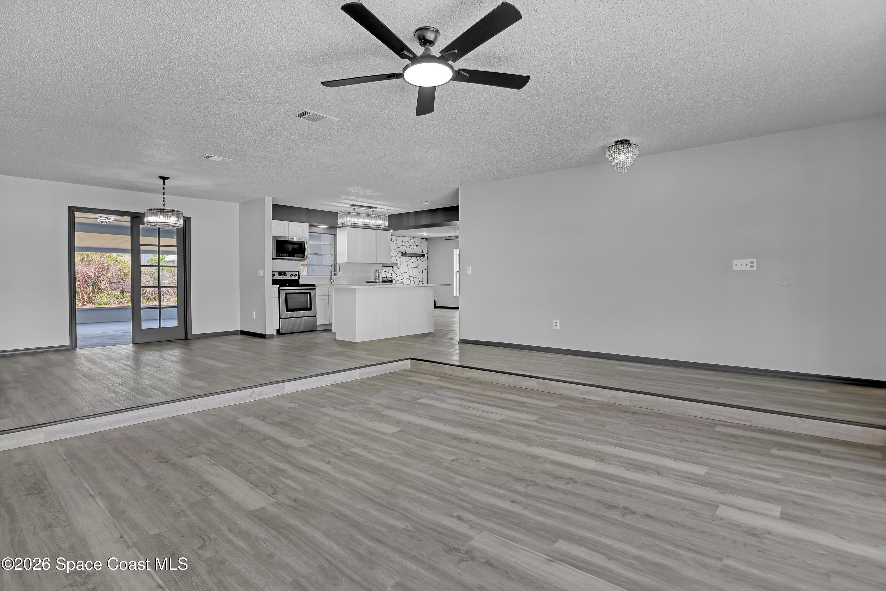 999 Castile Road Southeast Palm Bay, FL 32909 - Photo 9 of 45 Same Living Room