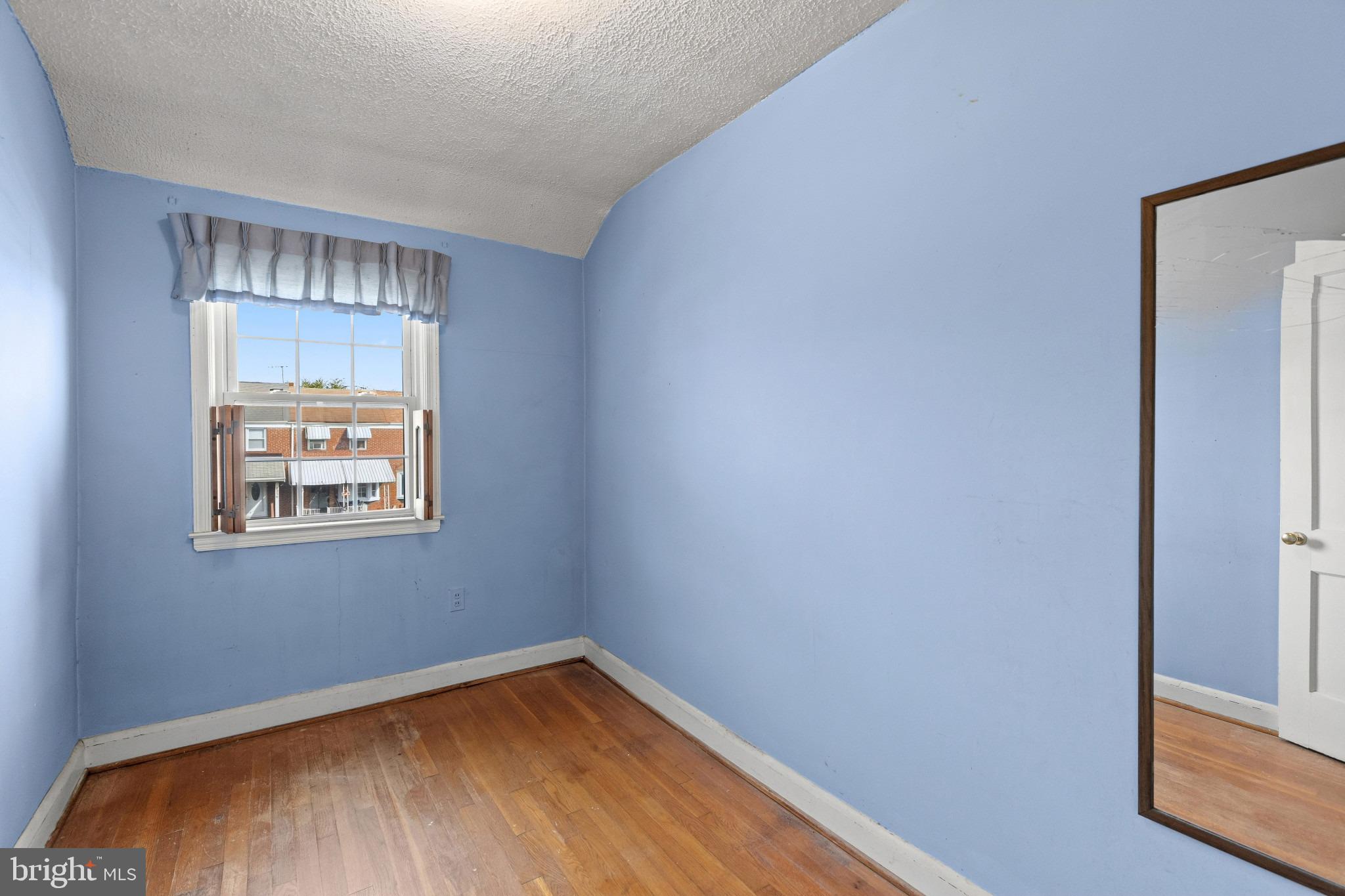 1957 Quentin Road Baltimore, MD 21222 - Photo 21 of 33 Bedroom Three with Hardwood Floors