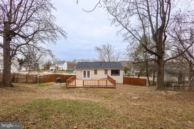 a view of house with outdoor space and sitting area