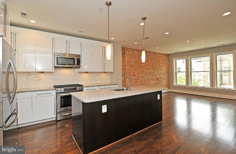 2431 Ontario Road Northwest, Unit 3 Washington, DC 20009 - Photo 4 of 14 Unit 3 Gourmet Kitchen w/ Exposed Brick