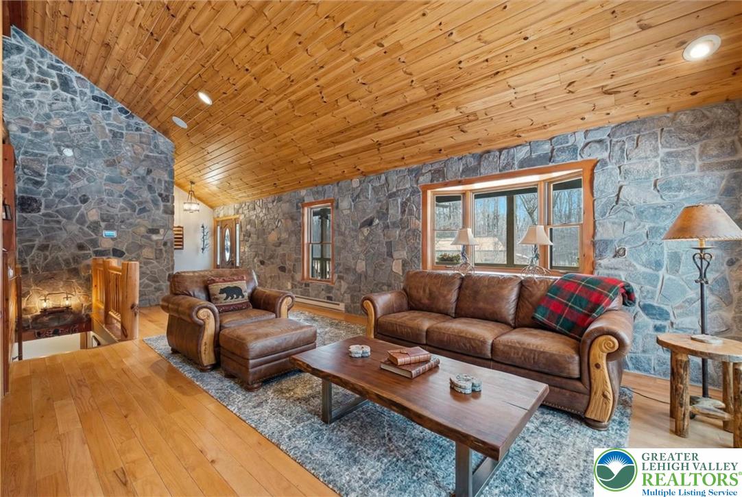 134 Split Rock Road Newfoundland, PA 18445 - Photo 17 of 84 a living room with furniture and a fireplace