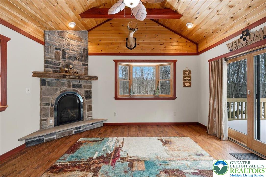 134 Split Rock Road Newfoundland, PA 18445 - Photo 29 of 84 a view of livingroom with furniture fire place and windows
