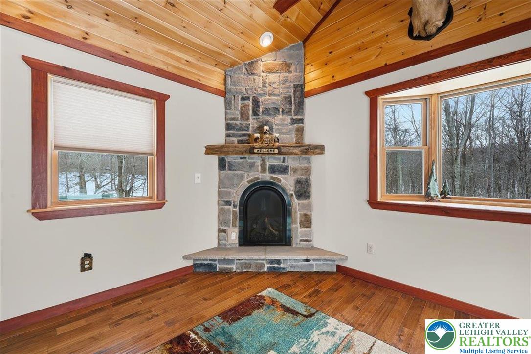 134 Split Rock Road Newfoundland, PA 18445 - Photo 31 of 84 a view of a room with window wooden floor and a fireplace