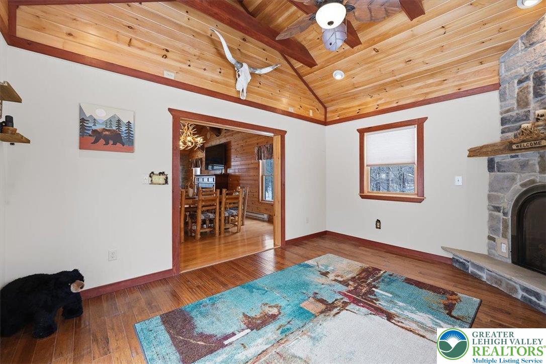 134 Split Rock Road Newfoundland, PA 18445 - Photo 32 of 84 a view of a hallway with wooden floor and a ceiling fan