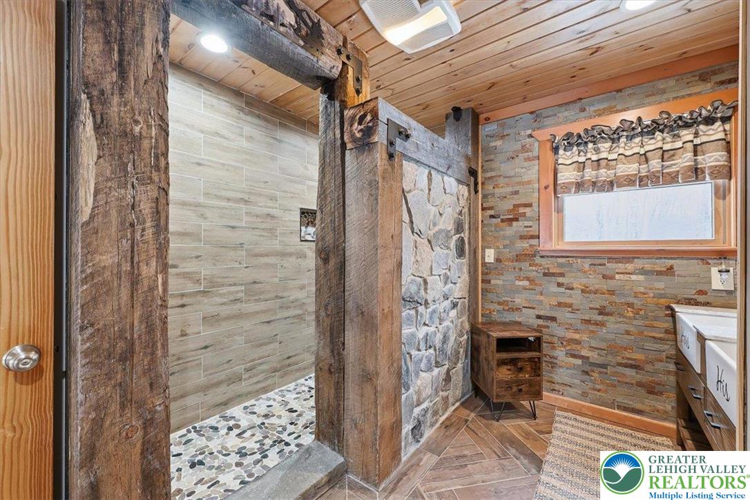 134 Split Rock Road Newfoundland, PA 18445 - Photo 45 of 84 a bathroom with a shower and a toilet