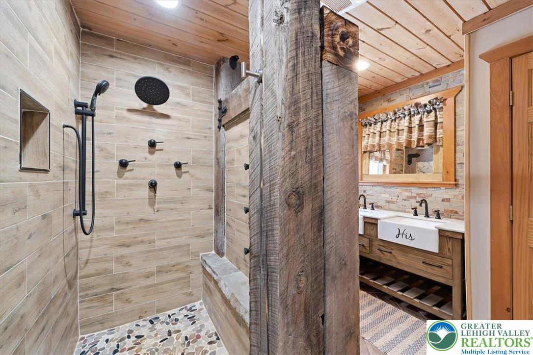 134 Split Rock Road Newfoundland, PA 18445 - Photo 46 of 84 a bathroom with a shower and a sink