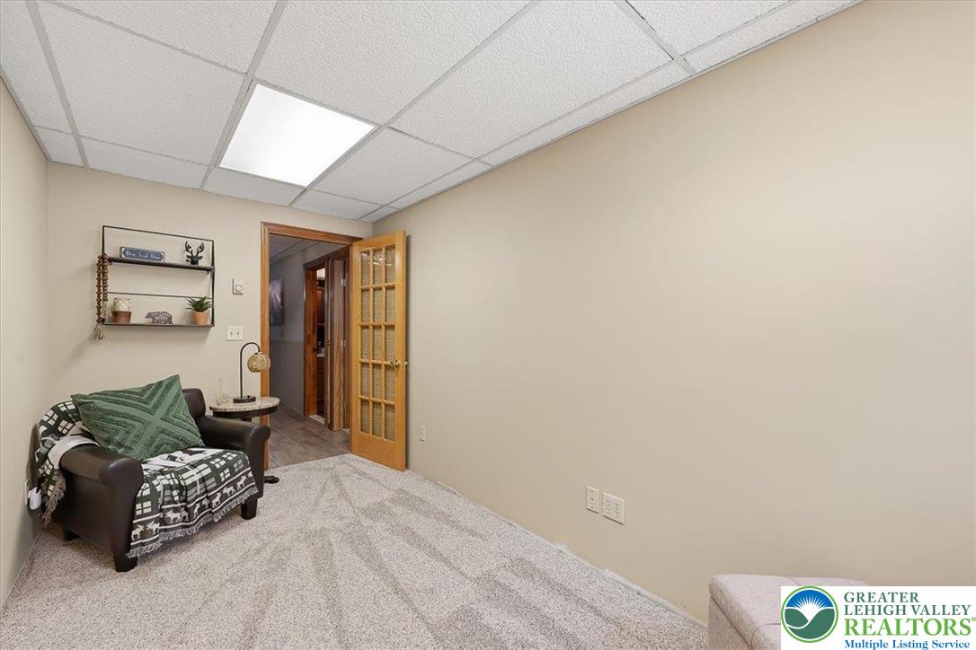 134 Split Rock Road Newfoundland, PA 18445 - Photo 53 of 84 a bedroom with a bed and a couch