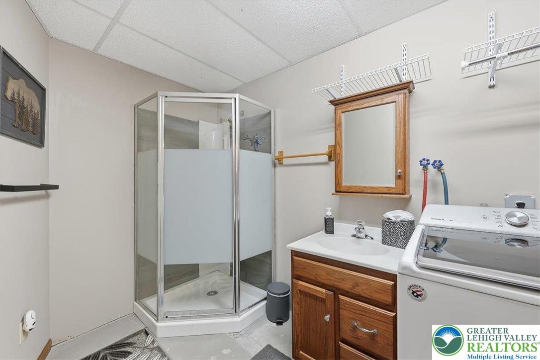 134 Split Rock Road Newfoundland, PA 18445 - Photo 64 of 84 a bathroom with a sink a toilet and shower