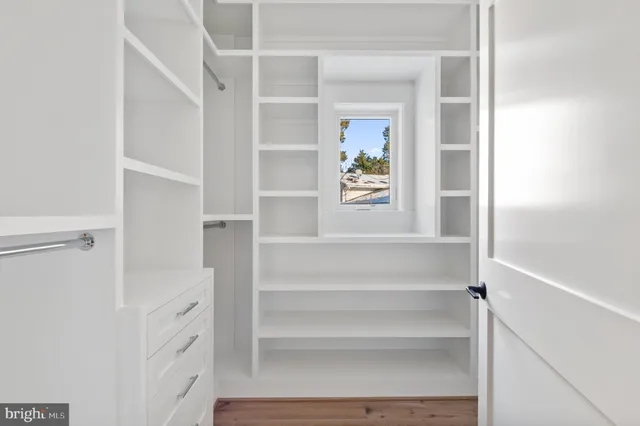a view of walk in closet with window