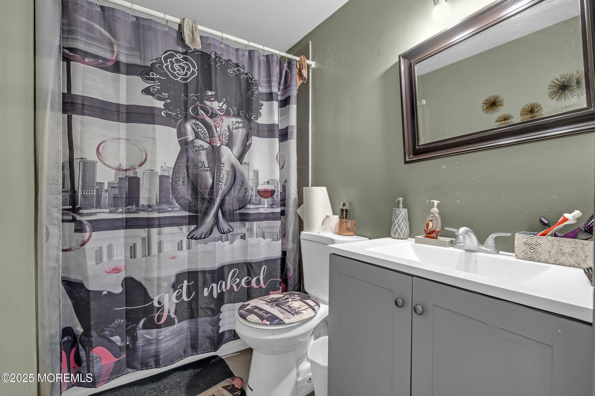 320 Pennsylvania Avenue Pine Beach, NJ 08741 - Photo 13 of 29 a bathroom with a sink and a mirror