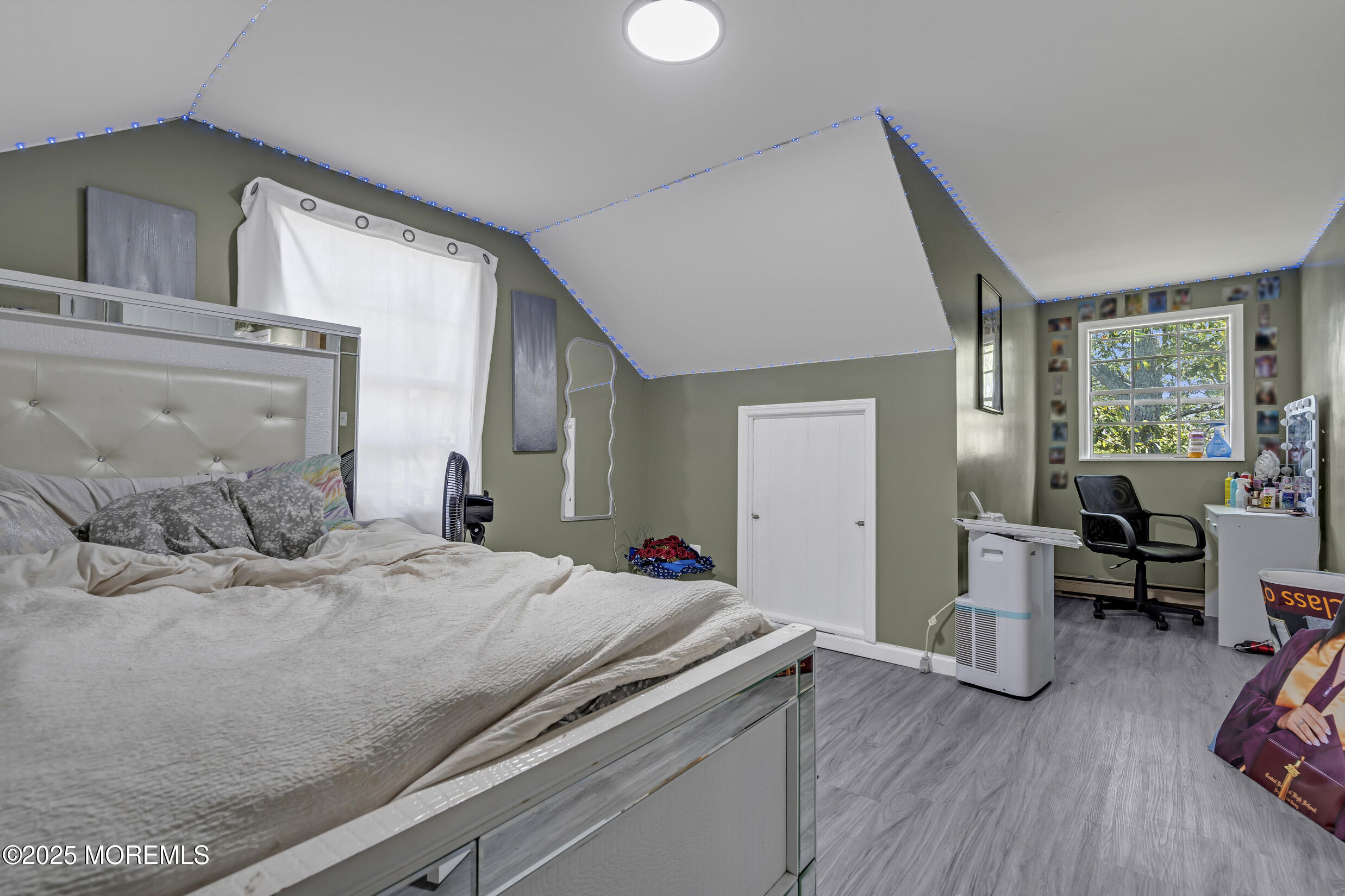 320 Pennsylvania Avenue Pine Beach, NJ 08741 - Photo 15 of 29 a bedroom with a bed and wooden floor