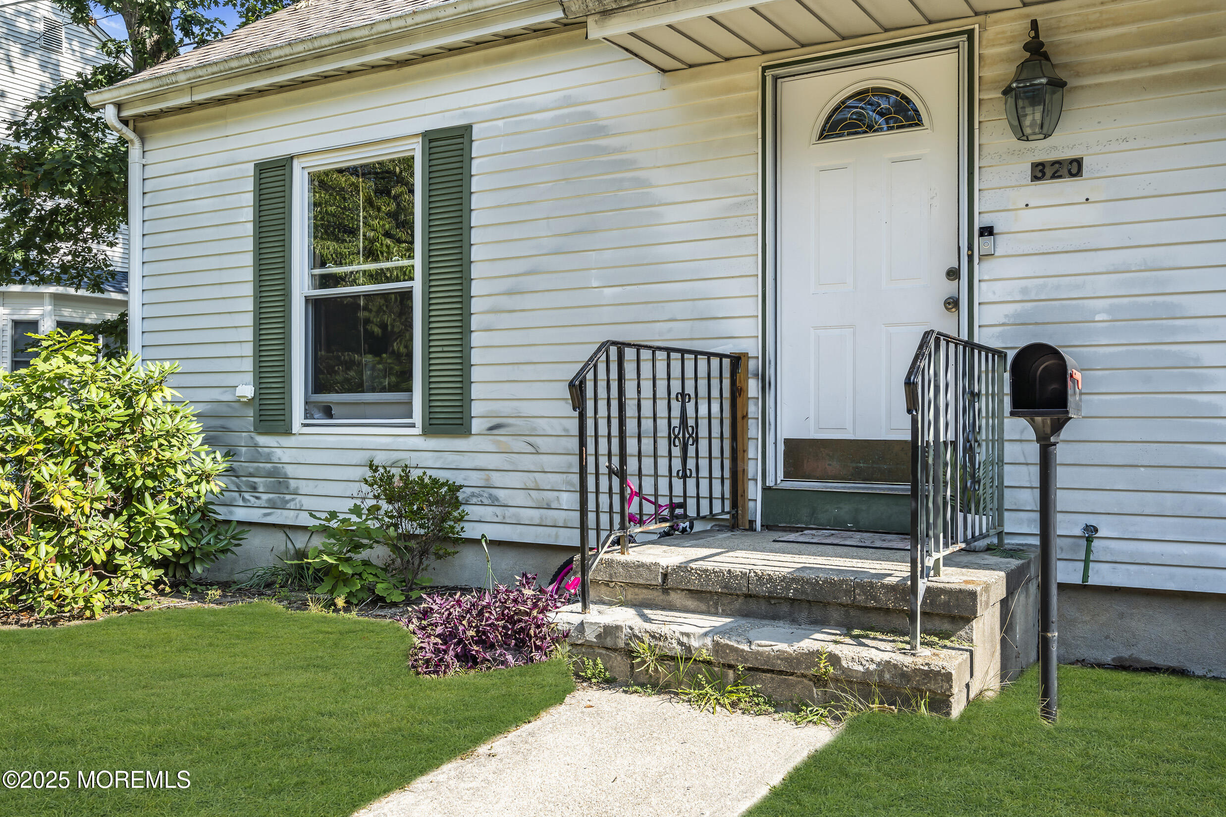 320 Pennsylvania Avenue Pine Beach, NJ 08741 - Photo 2 of 29 a front view of a house with garden