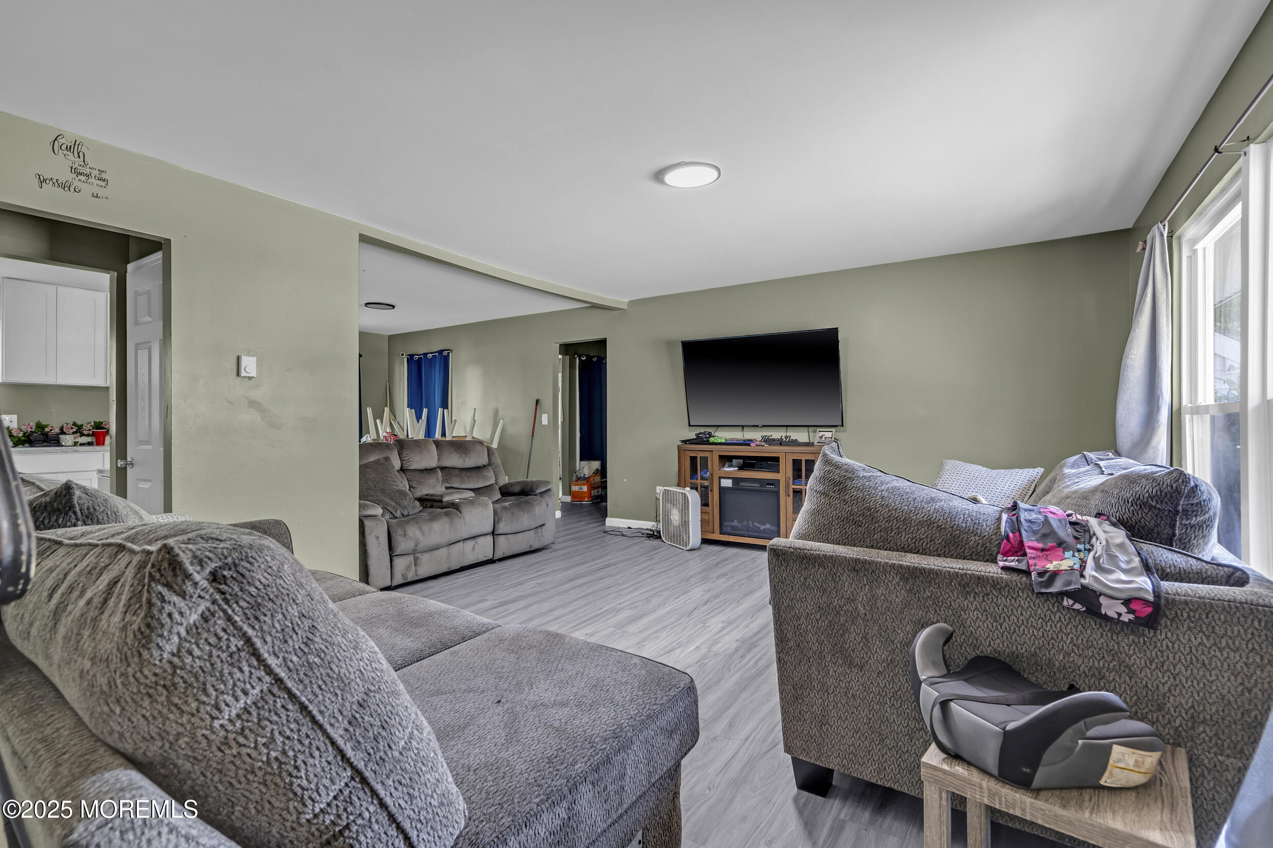 320 Pennsylvania Avenue Pine Beach, NJ 08741 - Photo 5 of 29 a living room with furniture and a flat screen tv