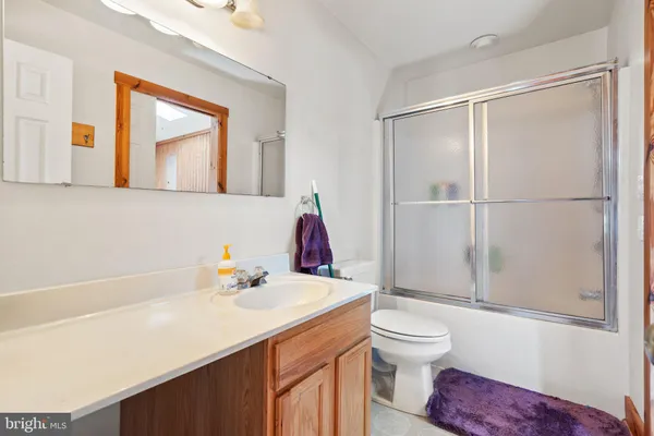 a room with a table and mirror