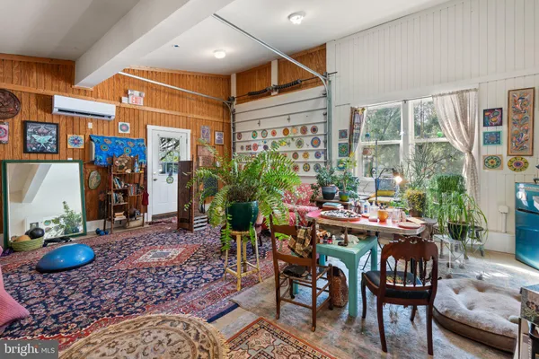 a living room with lots of furniture and a rug