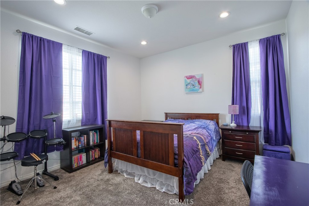 28483 Nautical Point Circle Menifee, CA 92585 - Photo 27 of 44 a bed sitting in a bedroom next to a window