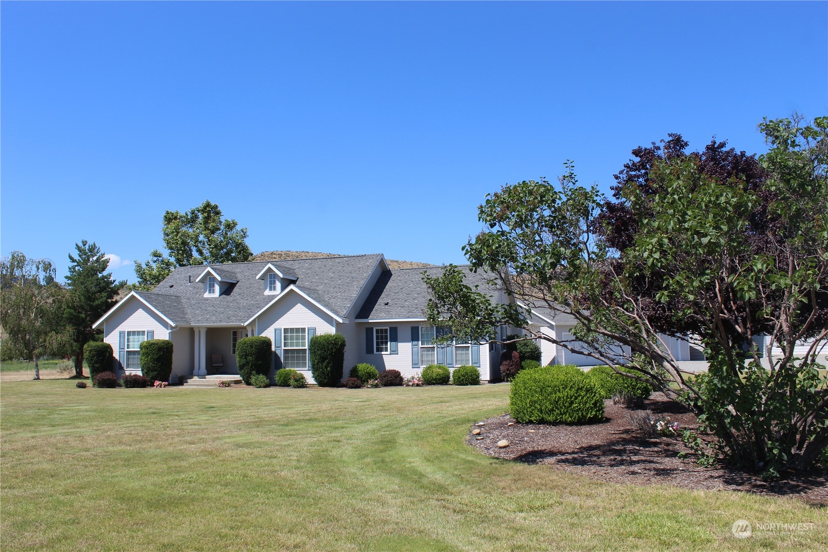 145 Pharr Road Riverside, WA 98849 - Photo 1 of 38 a front view of a house with a big yard