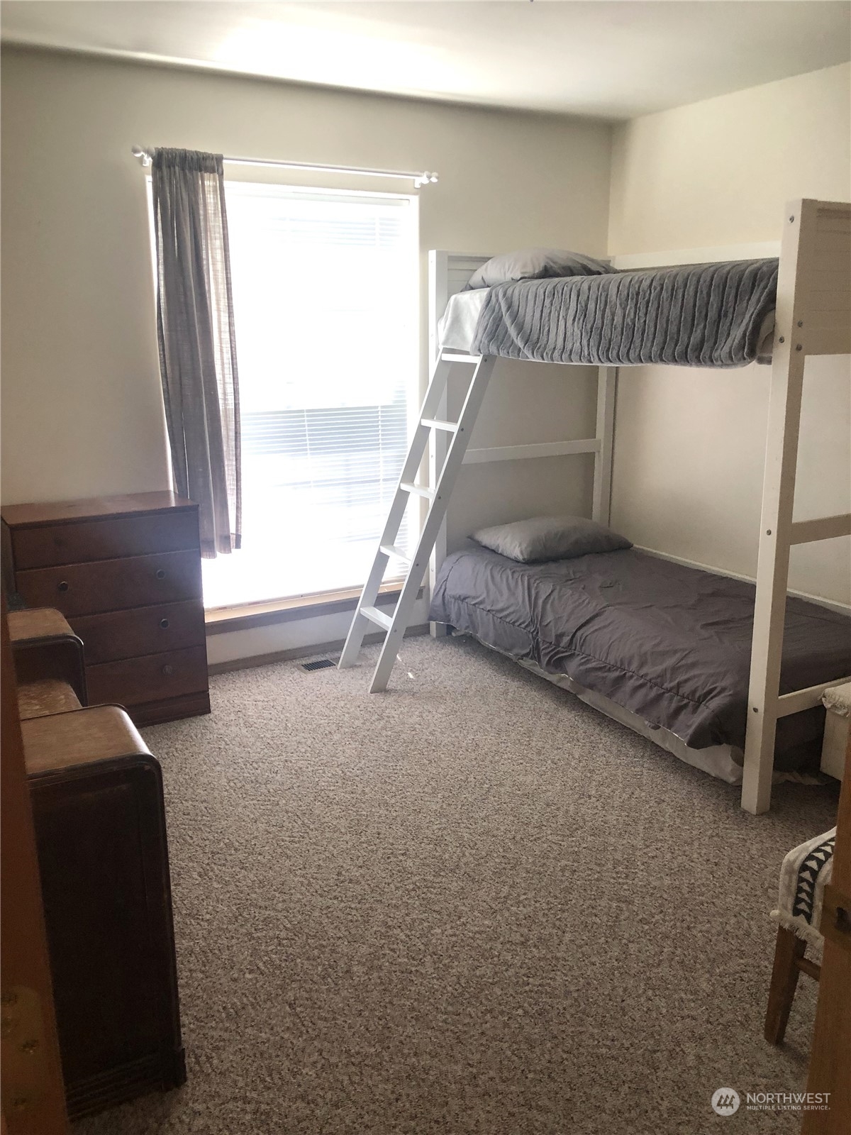 145 Pharr Road Riverside, WA 98849 - Photo 13 of 38 a bedroom with a bed and a window