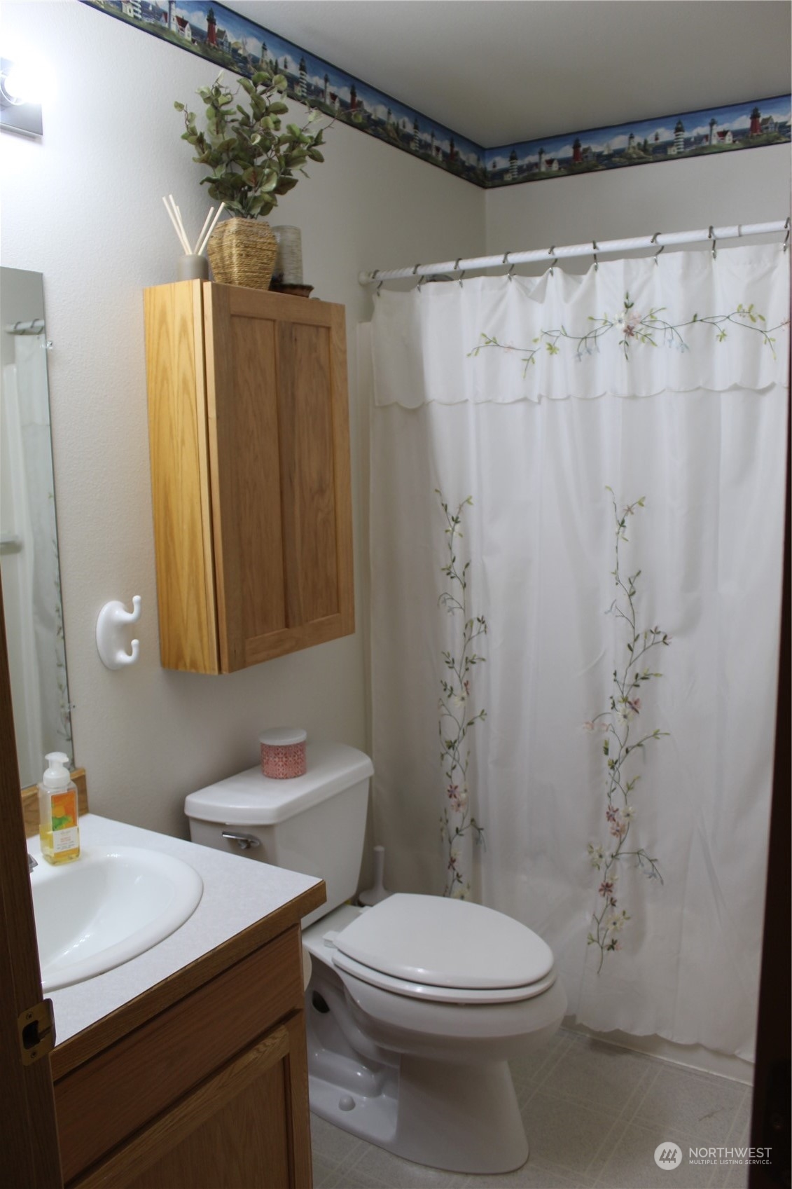 145 Pharr Road Riverside, WA 98849 - Photo 14 of 38 a bathroom with a sink a toilet and shower curtain