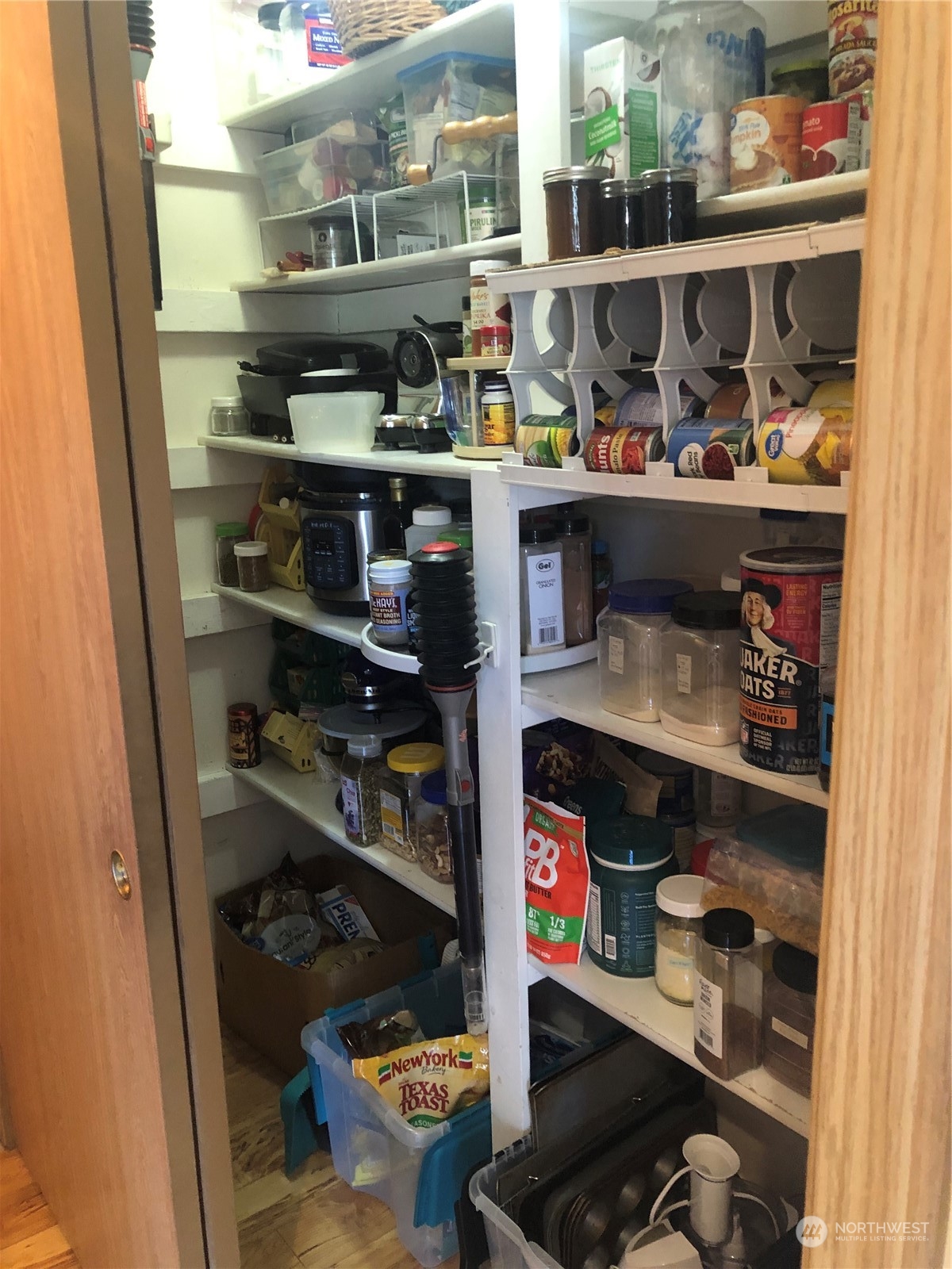 145 Pharr Road Riverside, WA 98849 - Photo 17 of 38 a kitchen with lots of bottles of alcohol