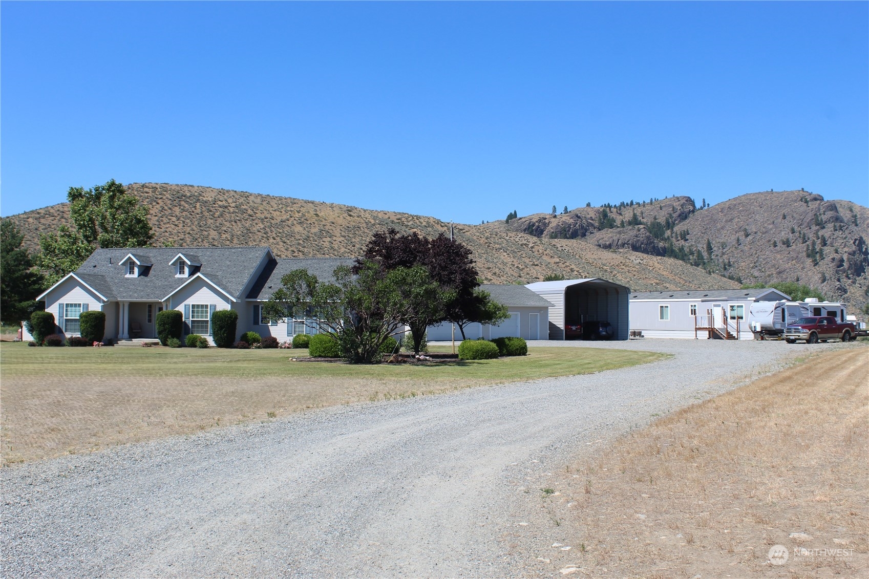 145 Pharr Road Riverside, WA 98849 - Photo 2 of 38 a front view of a house with a yard