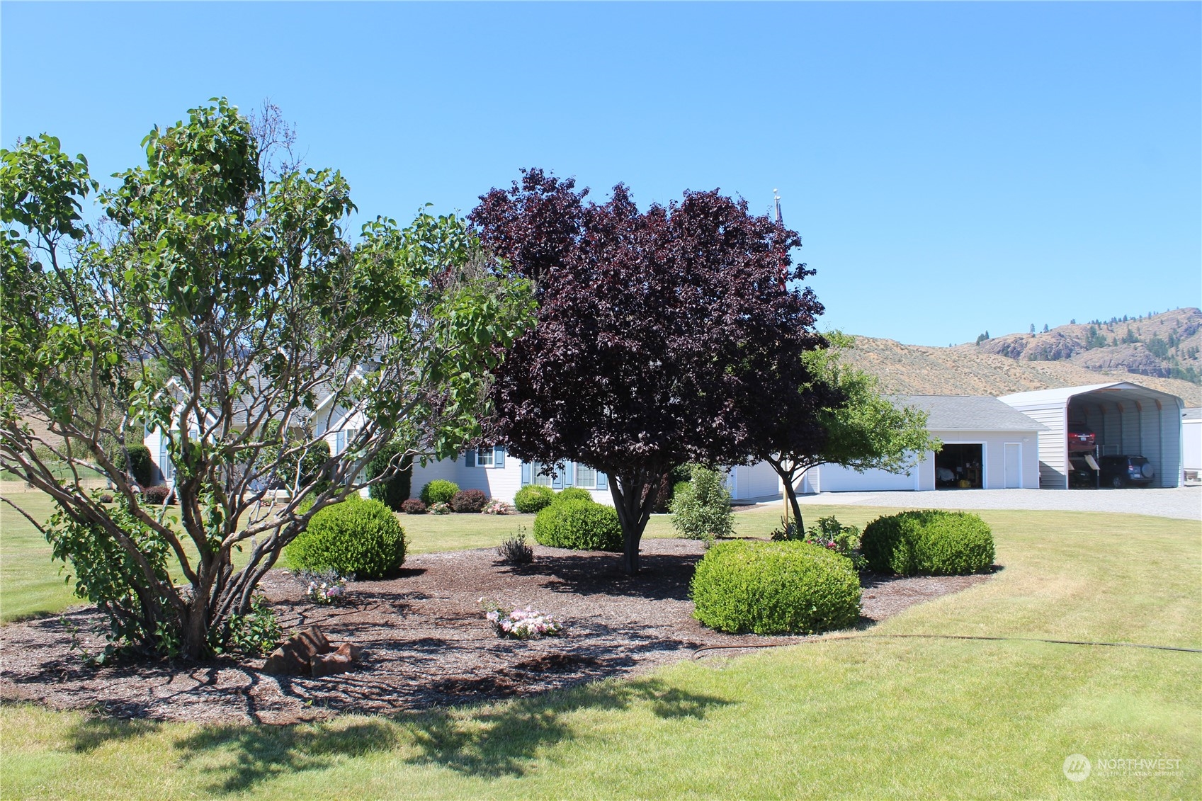 145 Pharr Road Riverside, WA 98849 - Photo 29 of 38 a view of a house with a yard