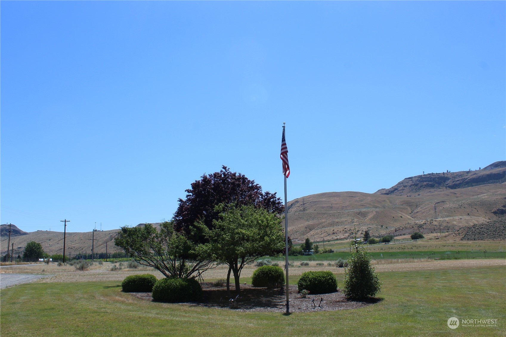 145 Pharr Road Riverside, WA 98849 - Photo 32 of 38 a view of a lake with a mountain in the background