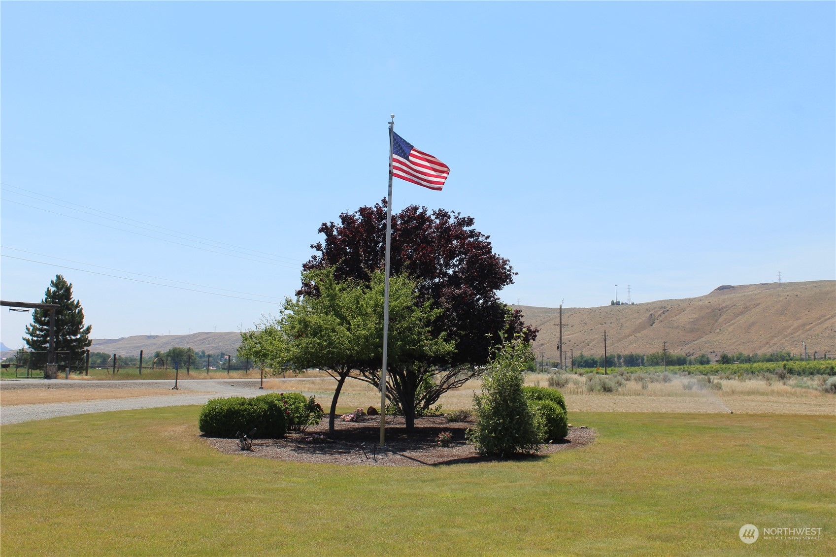 145 Pharr Road Riverside, WA 98849 - Photo 35 of 38 a swimming pool with lawn chairs and a yard