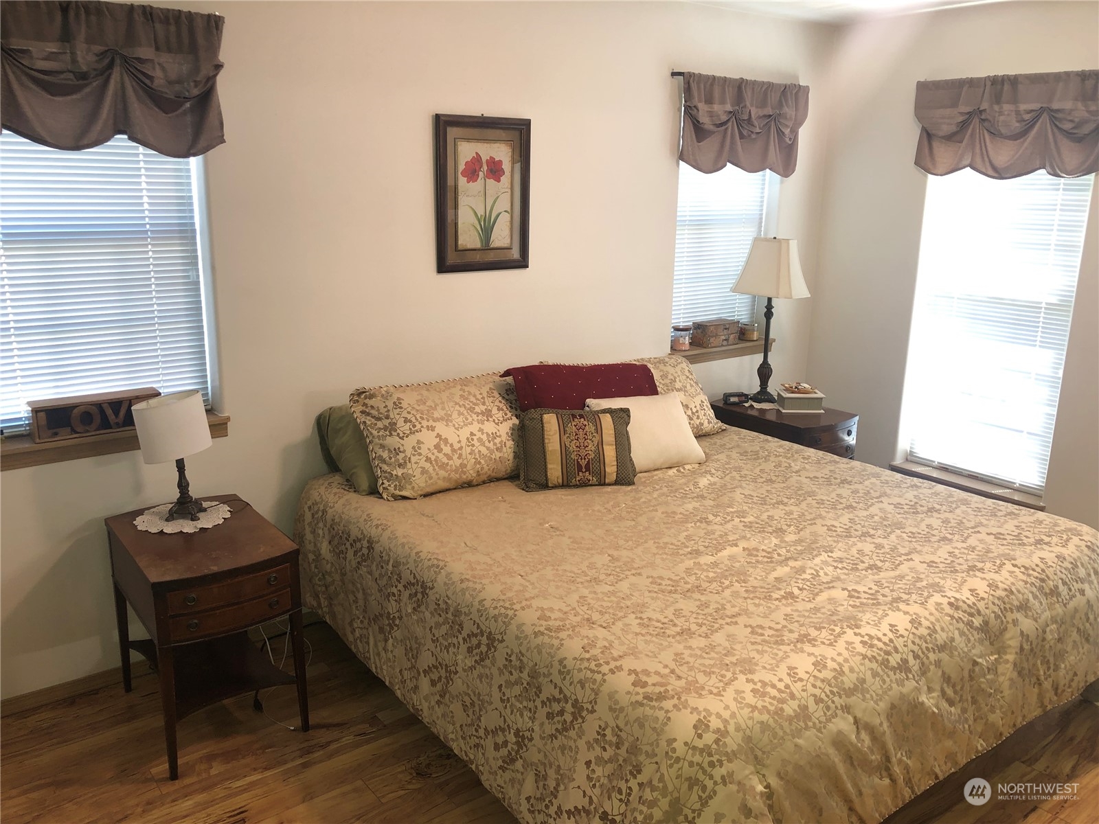 145 Pharr Road Riverside, WA 98849 - Photo 10 of 38 a bedroom with a bed and wooden floor