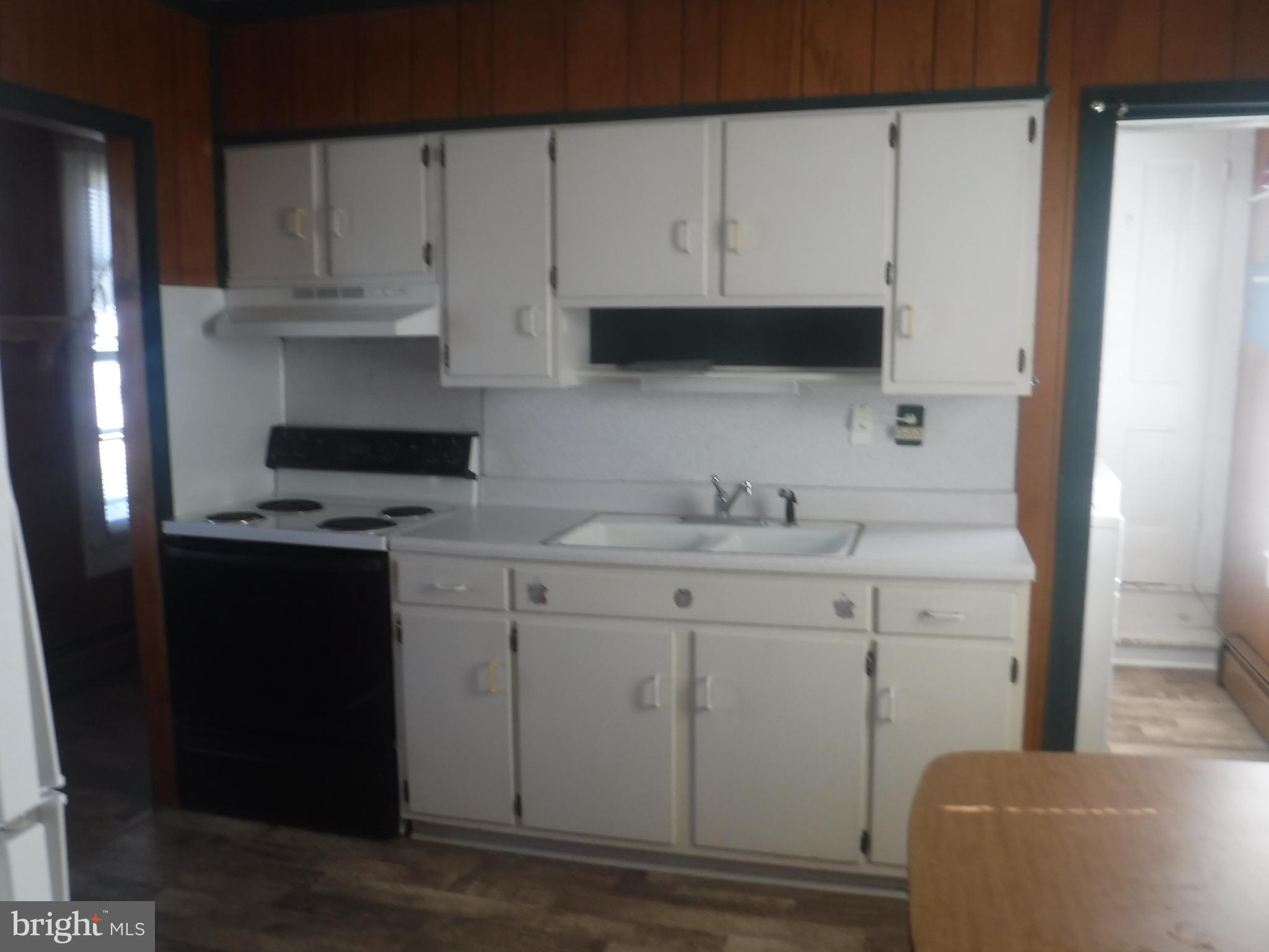 Apt #2-19 Apt, Unit 2 19 Felton, DE 19943 - Photo 2 of 10 a kitchen with a sink cabinets and appliances